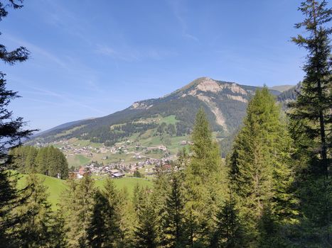 Val Gardena, Italy - 09/15/2020: Scenic alpine place with magical Dolomites mountains in background, amazing clouds and blue sky  in Trentino Alto Adige region, Italy, Europe