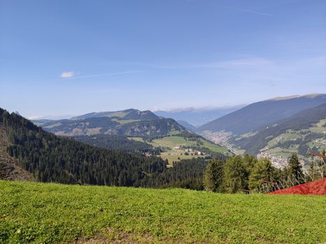 Val Gardena, Italy - 09/15/2020: Scenic alpine place with magical Dolomites mountains in background, amazing clouds and blue sky  in Trentino Alto Adige region, Italy, Europe