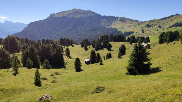 Val Gardena, Italy - 09/15/2020: Scenic alpine place with magical Dolomites mountains in background, amazing clouds and blue sky  in Trentino Alto Adige region, Italy, Europe