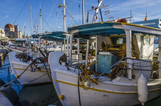 Fishing boats moored in the harbor of the island of Aegina in the Saronic Sea Greece