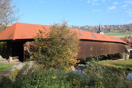 An old wooden covered bridge in Germany Unterregenbach