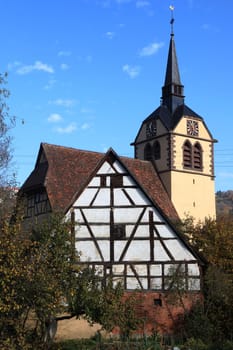 Old village church with half-timbered house in Unterregenbach Germany