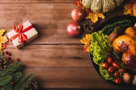 Thanksgiving roast turkey or chicken and vegetables, Top view Christmas dinner feast food decoration traditional homemade on wooden table background, Happy thanksgiving day of holiday concept