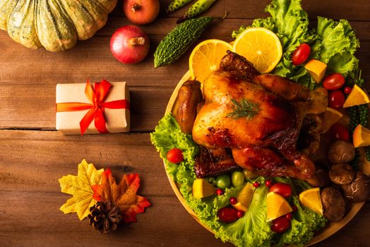 Thanksgiving roasted turkey or chicken and vegetables, Top view Christmas dinner feast food decoration traditional homemade on wooden table background, Happy thanksgiving day of holiday concept