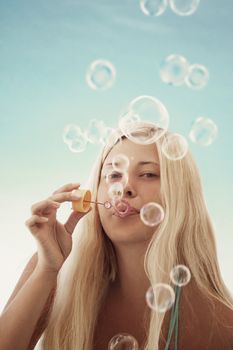 Blonde woman and soap bubbles in summertime, travel and beach lifestyle concept