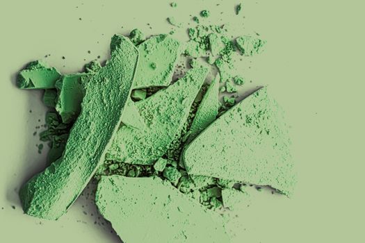 Green eye shadow powder as makeup palette closeup, crushed cosmetics and beauty textures