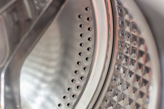 Drum of washing machine dry and clean close-up.Washing Dryer Machine inside view of a drum.