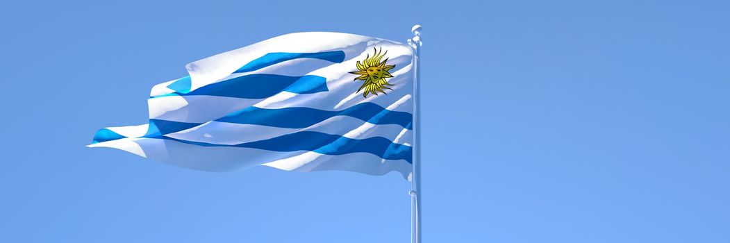 3D rendering of the national flag of Uruguay waving in the wind against a blue sky