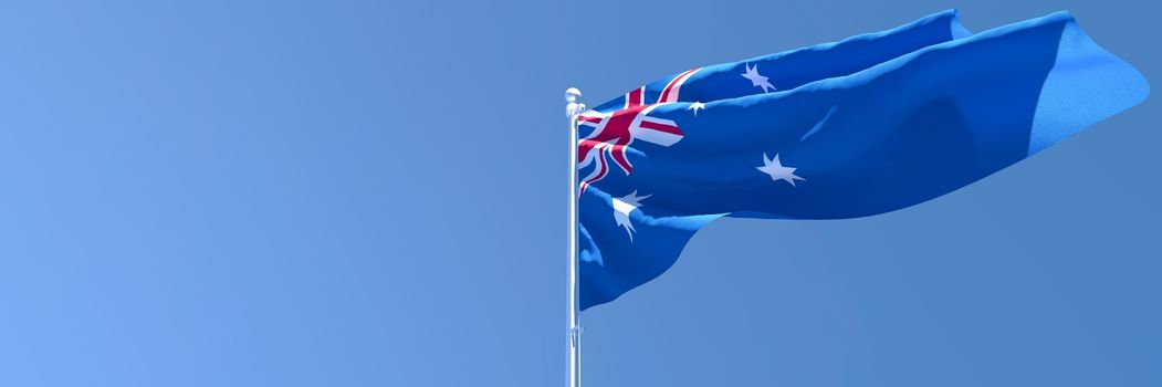 3D rendering of the national flag of Australia waving in the wind against a blue sky