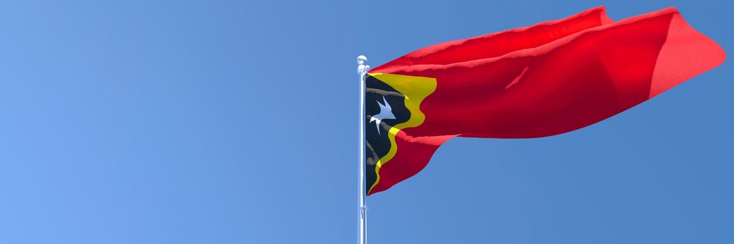 3D rendering of the national flag of East Timor in the wind against a blue sky