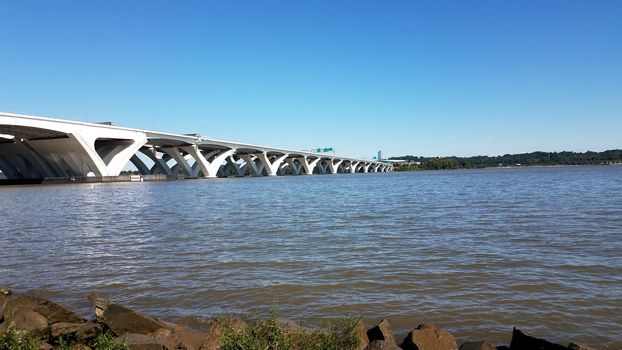 Potomac river with rocks and Wilson bridge in Alexandria, Virginia