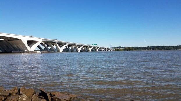 Potomac river with rocks and Wilson bridge in Alexandria, Virginia