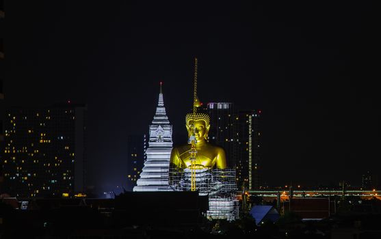 Bangkok, thailand - Sep 18, 2020 : Aerial view of Beautiful The Giant Golden Buddha in Wat Paknam Phasi Charoen Temple in Phasi Charoen district at night. Bangkok urban city, Thailand. Copy Space, Selective focus.
