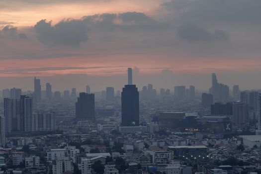 Bangkok downtown cityscape with skyscrapers at evening give the city a modern style. No focus, specifically.