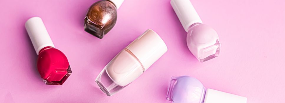 Nail polish bottles on pink background, beauty branding