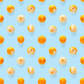 Fresh mandarin Seamles pattern. Ripe fruit tangerines seamless pattern. Fresh citrus isolated on blue background pattern. Flat lay of Clementine. Mandarine modern tropical seamless background.