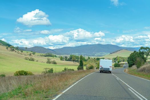 Road Trip - Retirees in their caravan motoring along a country highway