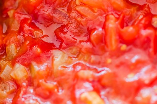 Cooking tomato sauce, closeup steamed vegetables for cook book or food blog backgrounds