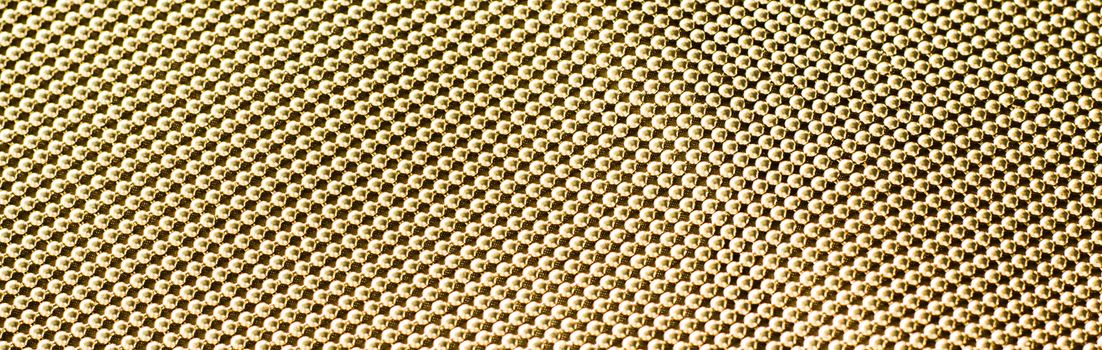 Golden metallic abstract background, futuristic surface and high tech materials