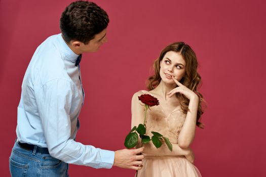 married couple man and woman romance red rose isolated background holiday flowers. High quality photo