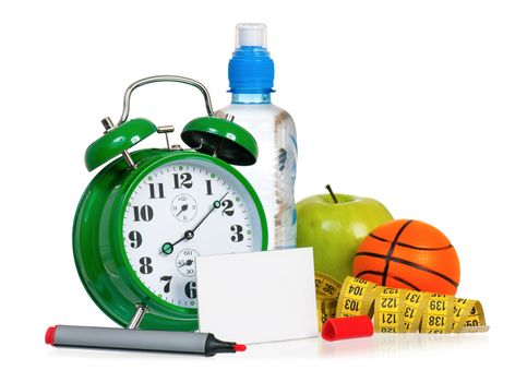 Alarm clock with bottle of water, fresh green apple, measuring tape and empty blank paper card sign for text with red marker, isolated on white background