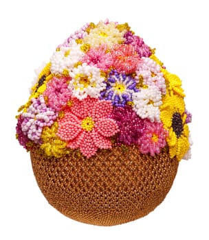 Easter egg decorated with beads isolated on white background.