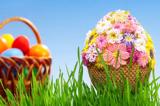 Easter egg decorated with beads in green grass