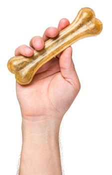 Male hand holding Dog chew bone food - pet accessories for eat, isolated on white background with copy space