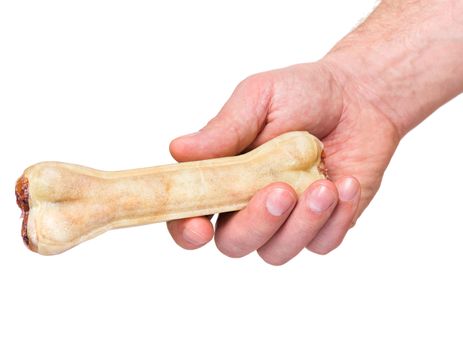 Male hand holding Dog chew bone food - pet accessories for eat, isolated on white background with copy space