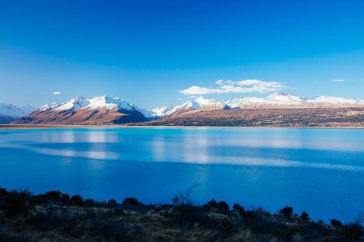 State Highway 80 near Mt Cook Village at Peter's Lookout next to Lake Pukaki on a clear sunny spring afternoon in New Zealand