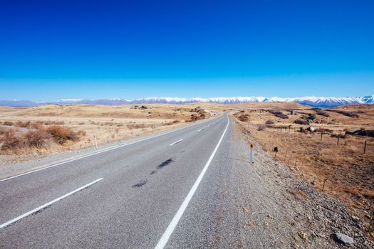 Roads and driving around Lake Pukaki on a clear sunny spring day in New Zealand