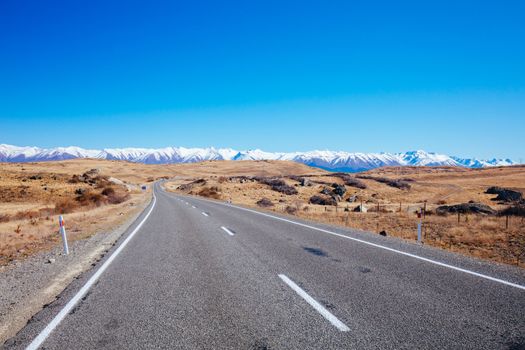 Roads and driving around Lake Pukaki on a clear sunny spring day in New Zealand