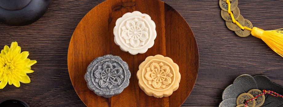 Colorful beautiful moon cake, mung bean cake, Champion Scholar Pastry cake for Mid-Autumn festival traditional gourmet dessert snack, top view, flat lay.