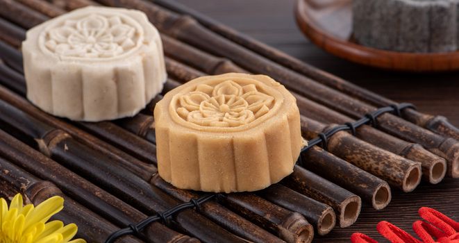 Colorful beautiful moon cake, mung bean cake, Champion Scholar Pastry cake for Mid-Autumn festival traditional gourmet dessert snack, close up.