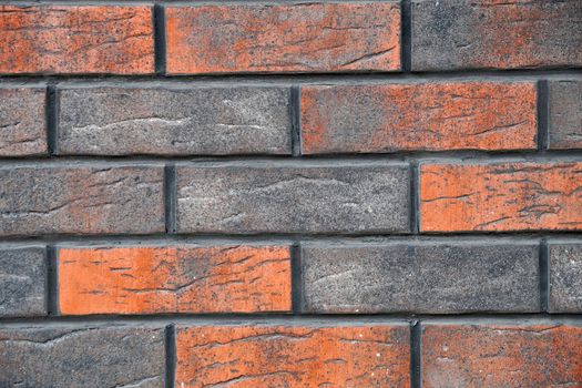 brown mottled decorative brick wall for background close up