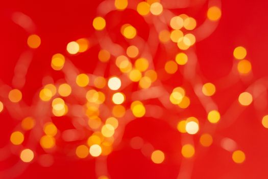 Christmas holiday background with festive bokeh on red background. Ready-to-install products. blur and bokeh. holiday blur lights. copy space. space for text.