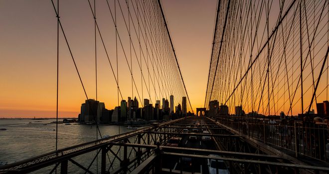 Brooklyn Bridge sunset with Manhattan skyline in New York