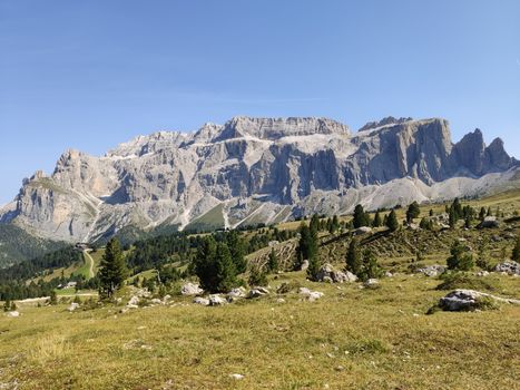 Val Gardena, Italy - 09/15/2020: Scenic alpine place with magical Dolomites mountains in background, amazing clouds and blue sky in Trentino Alto Adige region, Italy, Europe