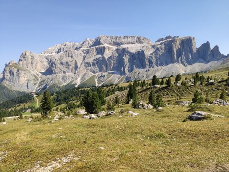 Val Gardena, Italy - 09/15/2020: Scenic alpine place with magical Dolomites mountains in background, amazing clouds and blue sky in Trentino Alto Adige region, Italy, Europe