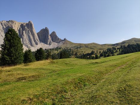 Val Gardena, Italy - 09/15/2020: Scenic alpine place with magical Dolomites mountains in background, amazing clouds and blue sky in Trentino Alto Adige region, Italy, Europe