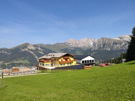 Val Gardena, Italy - 09/15/2020: Scenic alpine place with magical Dolomites mountains in background, amazing clouds and blue sky in Trentino Alto Adige region, Italy, Europe