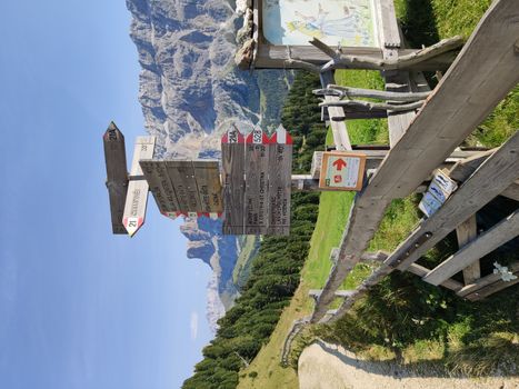 Val Gardena, Italy - 09/15/2020: Scenic alpine place with magical Dolomites mountains in background, amazing clouds and blue sky in Trentino Alto Adige region, Italy, Europe