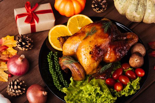 Thanksgiving roast turkey or chicken and vegetables, Top view Christmas dinner feast food decoration traditional homemade on wooden table background, Happy thanksgiving day of holiday concept