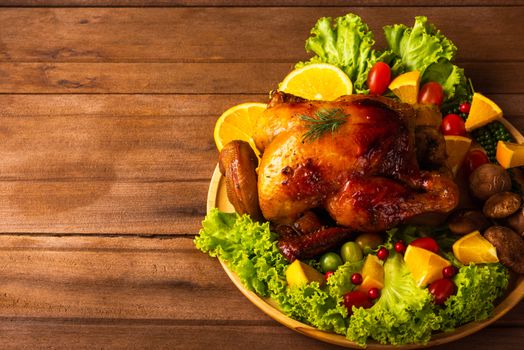 Thanksgiving roast turkey or chicken and vegetables, Top view Christmas dinner feast food decoration traditional homemade on wooden table background, Happy thanksgiving day of holiday concept