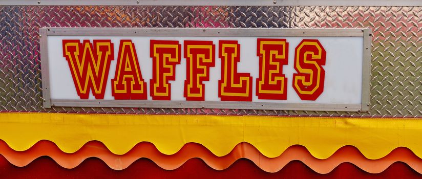 Bright and colorful waffles sign at an Australian country show