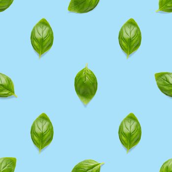 Italian Basil leaf herb seamless pattern on blue background, Creative seamless pattern made from fresh green basil flat lay layout. Food ingredient seamless pattern.