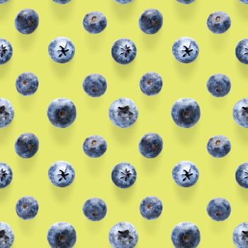 Trendy seamless pattern of blueberries. Blueberry pattern isolated on green background. Blueberry flat lay, can be used for textile, prints, packing designs orother moden andcreative works