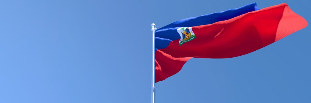 3D rendering of the national flag of Haiti waving in the wind against a blue sky