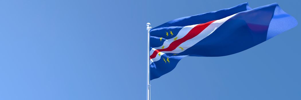 3D rendering of the national flag of Cape Verde waving in the wind against a blue sky