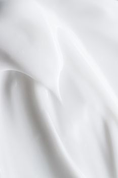 Pure white cream texture as abstract background, food substance or organic cosmetics